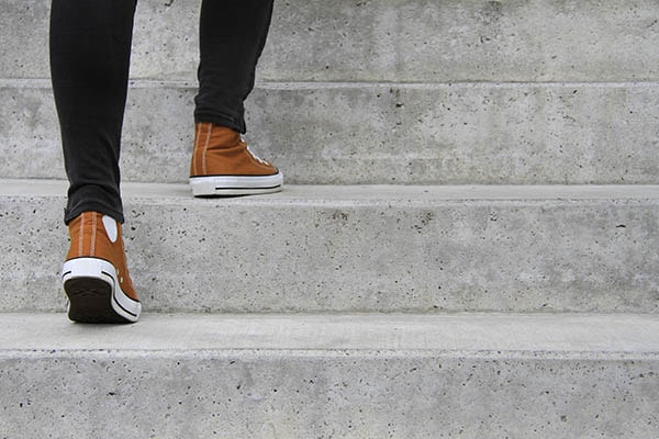 A person walking up the stairs.