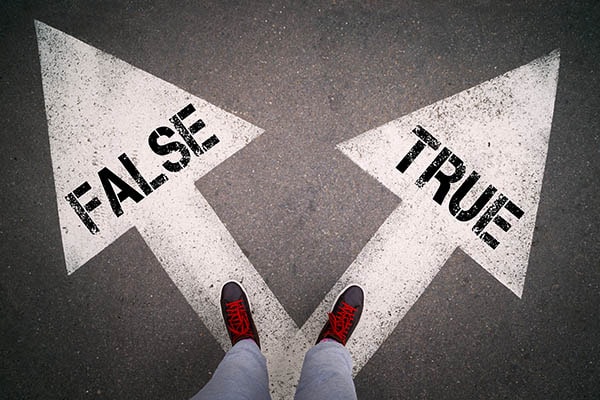 Feet standing at true and false arrows