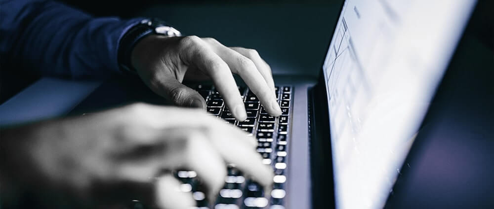 Person typing on computer