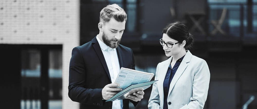 Two people looking at documents